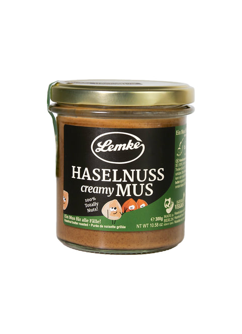 Glas mit Lemke Haselnuss Creamy Mus – 100% geröstete Haselnüsse, vegan, ohne Zusätze. Perfekt für Aufstriche, Backwaren & Desserts.